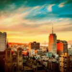 buildings under cloudy sky during sunset