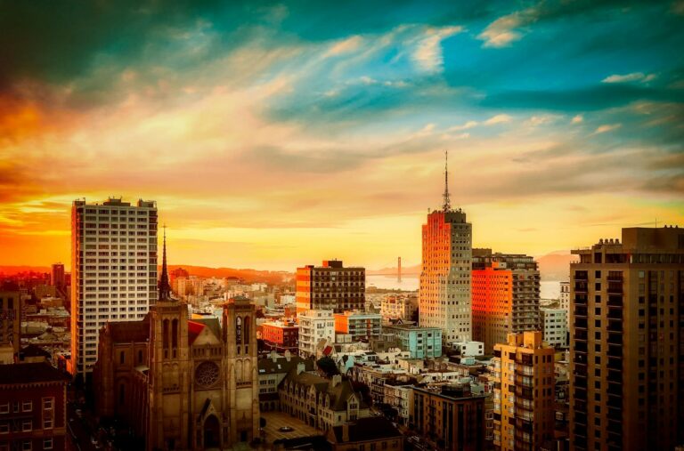 buildings under cloudy sky during sunset